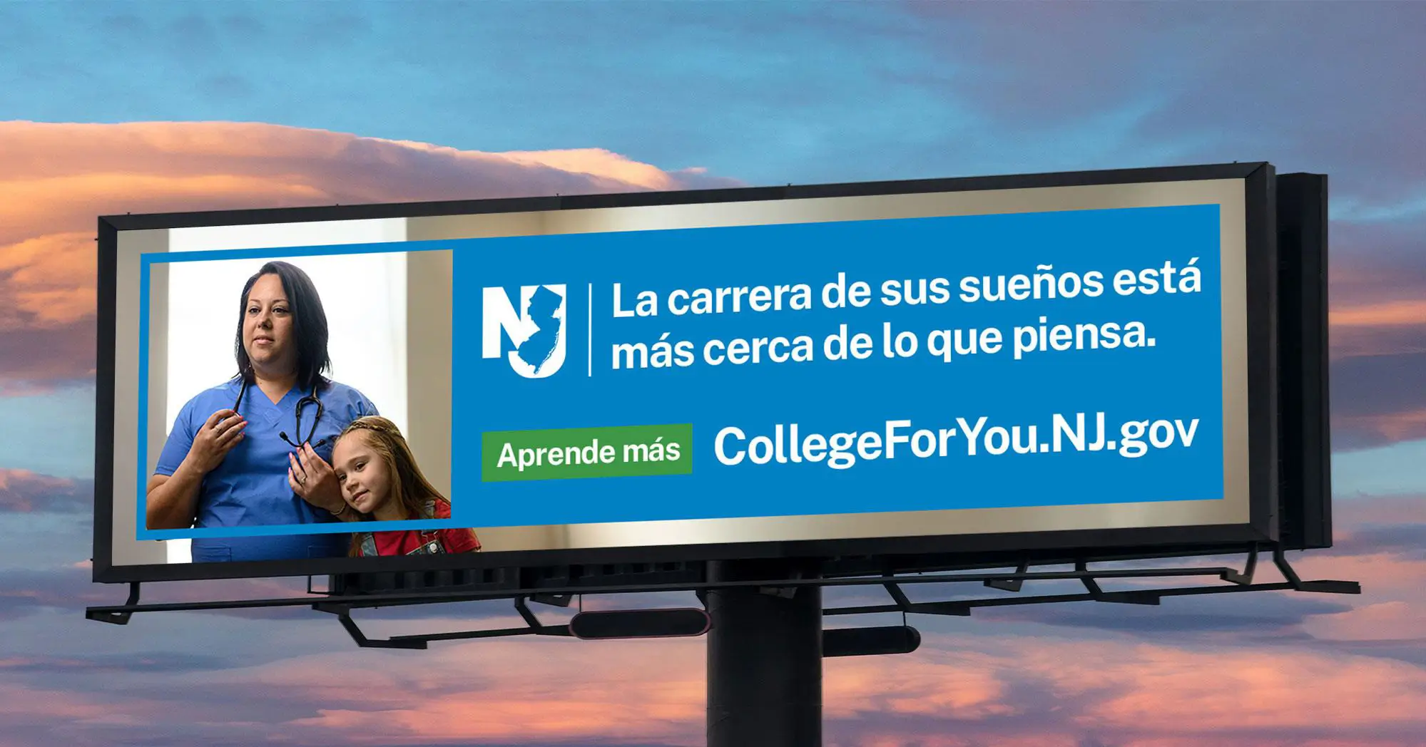A billboard of a Mom proudly wearing her scrubs as her daughter looks on.