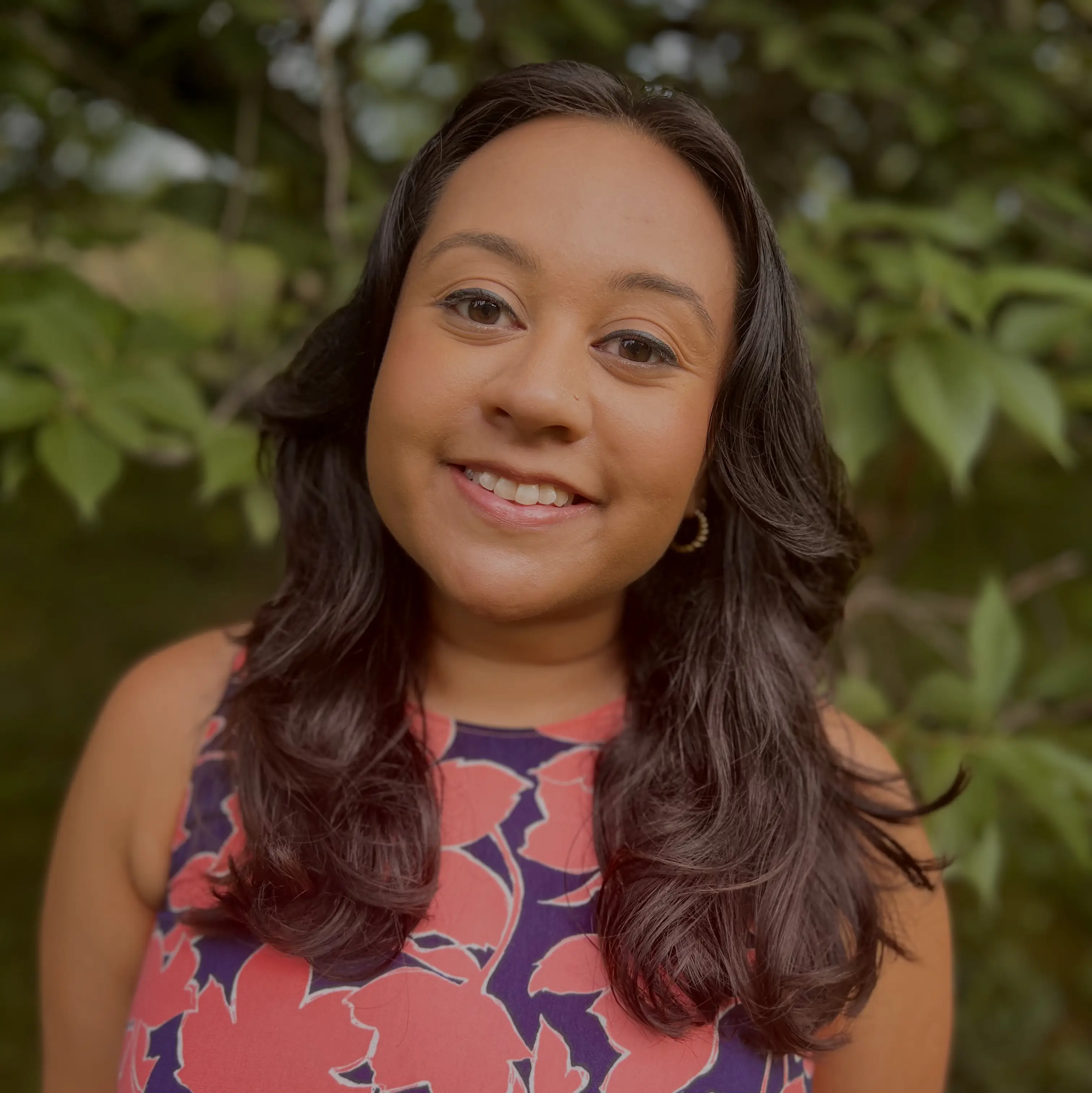 Headshot photograph of Amani Farooque